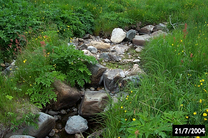 A rock dam to create a reservoir for fresh water.